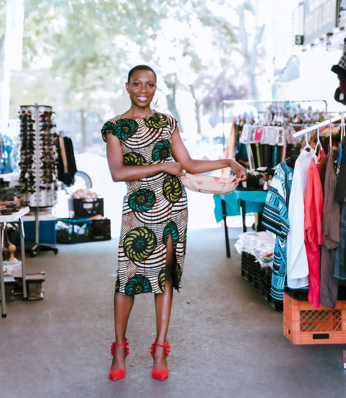 Nkonye in a market holding a basket