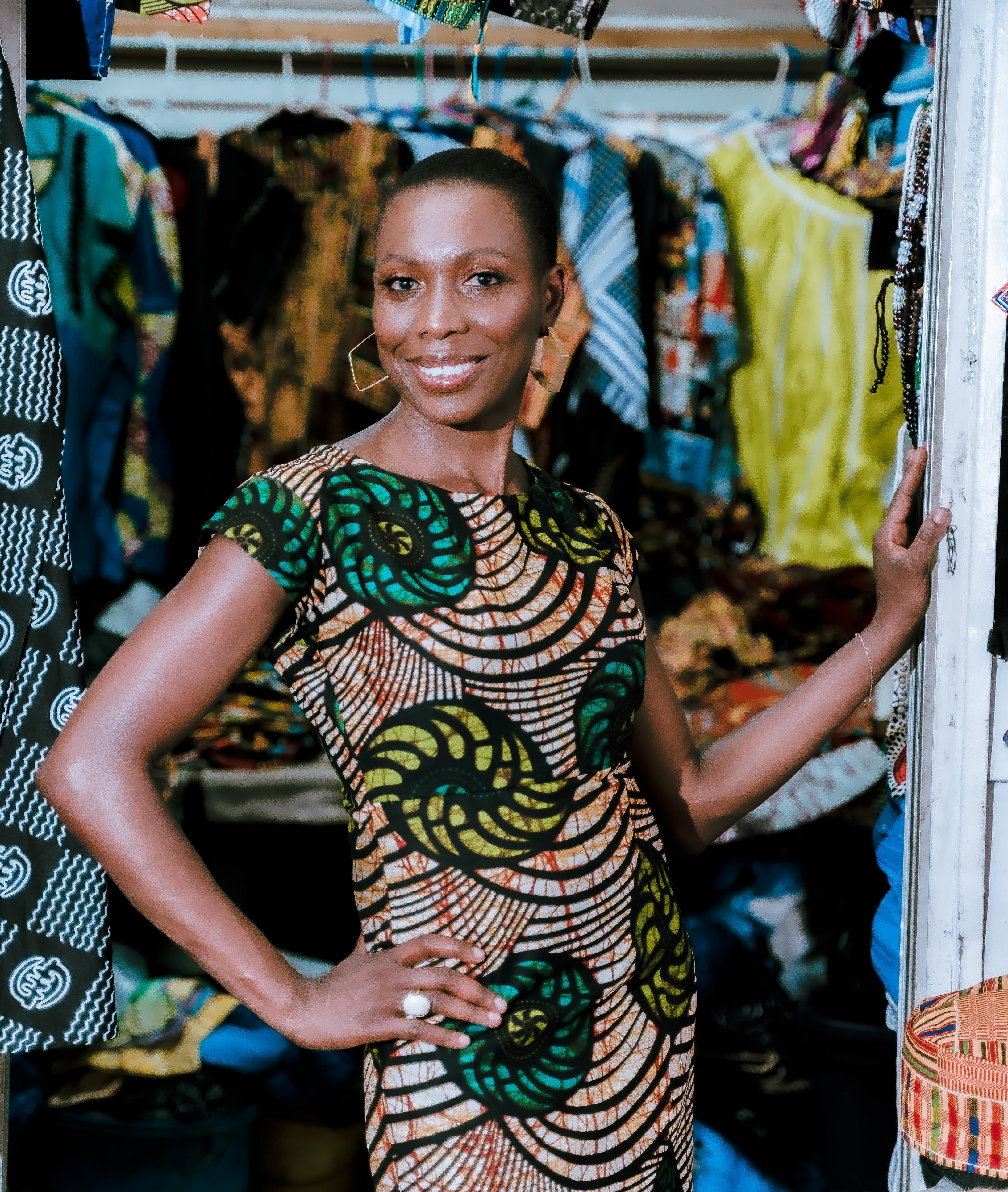 Nkonye smiling in a doorway